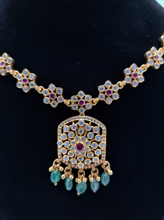 Floral white stone with center Ruby Necklace