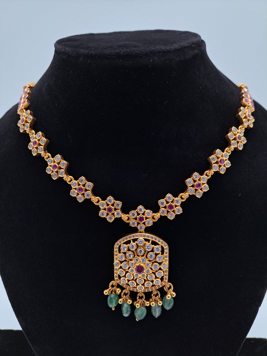 White stone Ruby Centered Gold Polish Necklace